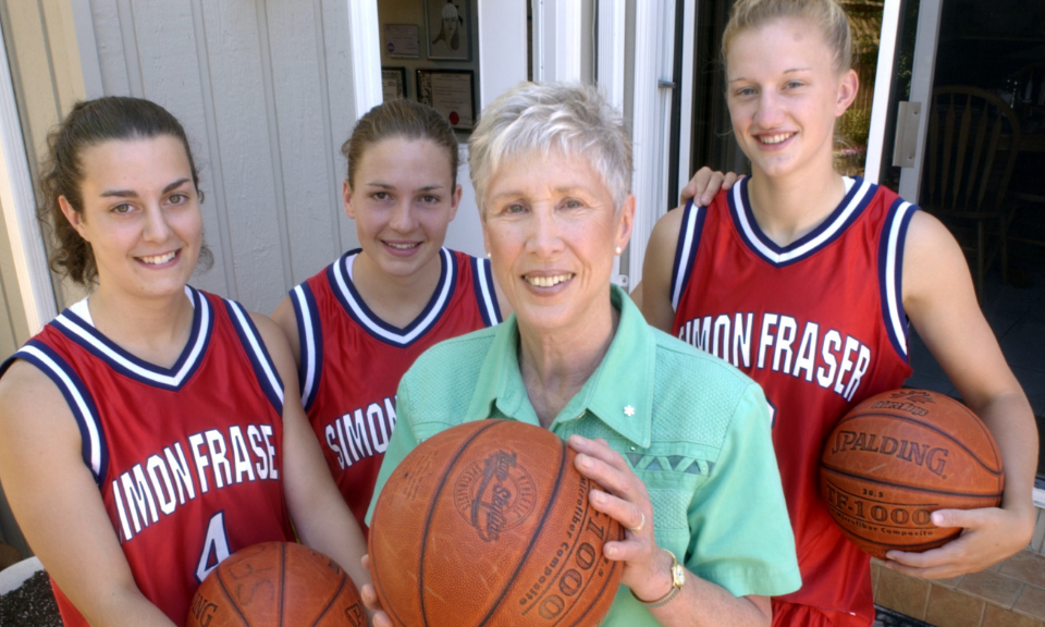 Barbara Rae with members of SFU Women's basketball team